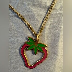 Gold tone and Pink Foxy brand Strawberry Necklace with Green Leaf Accent